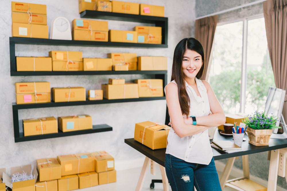 Small business owner preparing online marketing orders in an office