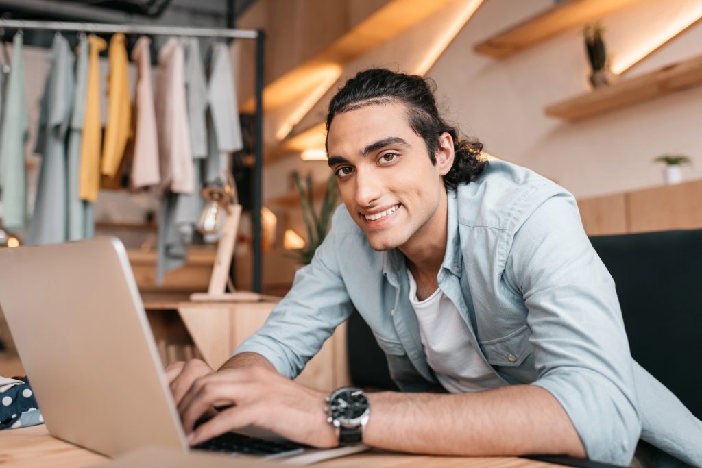 Small business owner planning local search on a laptop