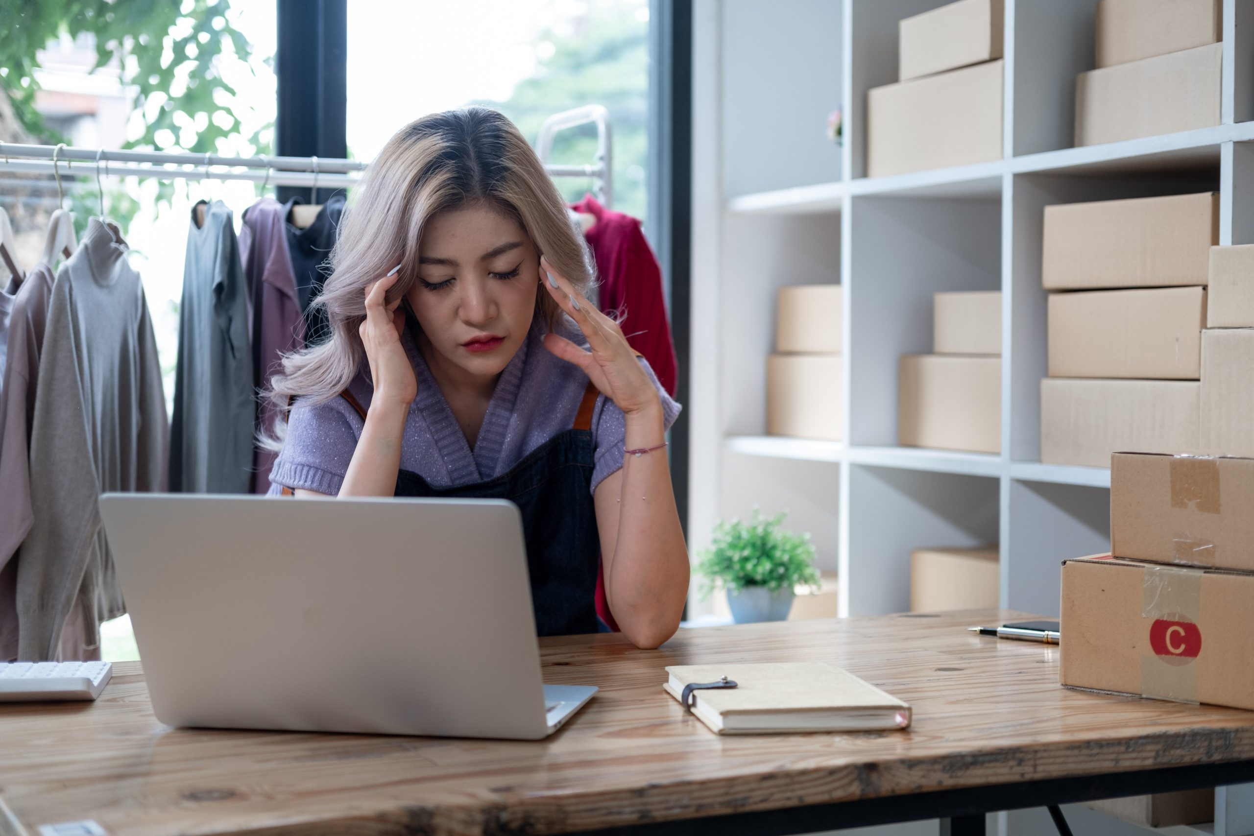 Small business owner checking a Google Business Profile suspended notice and how to fix it